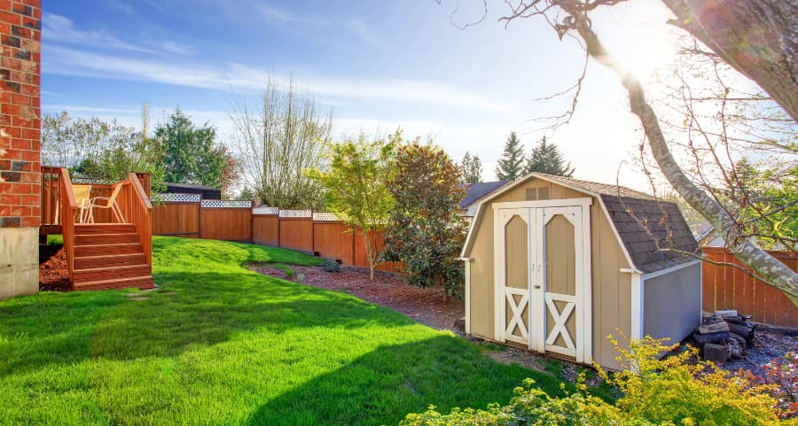 Fenced backyard with storage shed in Charlottesville